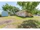 Spacious backyard with shed and view of the home at 1480 Wauchula St, Intercession City, FL 33848