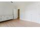 Bright bedroom featuring wood floors, a chest of drawers, and a spacious closet for storage at 1480 Wauchula St, Intercession City, FL 33848