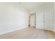 Bedroom featuring wood floors and bright white walls, providing a versatile space for personalization at 1480 Wauchula St, Intercession City, FL 33848