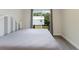 Well-lit bedroom featuring wood-look floors, neutral walls and a modern grey and white headboard at 1480 Wauchula St, Intercession City, FL 33848