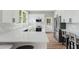 Bright, updated kitchen features white countertops, modern appliances, and breakfast bar seating at 1480 Wauchula St, Intercession City, FL 33848