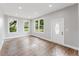 Sun-filled living room features modern finishes, new flooring, recessed lighting, and ample natural light at 1480 Wauchula St, Intercession City, FL 33848