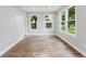 Bright living room with new wood floors and windows offering natural light at 1480 Wauchula St, Intercession City, FL 33848