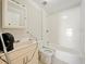 Full bathroom with standard tub, tile surround, and standard vanity at 1519 Illinois Ave, St Cloud, FL 34769