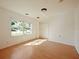 Bedroom featuring a window, closet, and hardwood floors at 1519 Illinois Ave, St Cloud, FL 34769