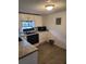 Kitchen showcasing white cabinets, granite countertops, and essential appliances at 1519 Illinois Ave, St Cloud, FL 34769