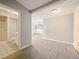 Open living area featuring tiled flooring and view into bathroom and kitchen at 1519 Illinois Ave, St Cloud, FL 34769