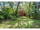 Large backyard with grass and trees, great for entertainment and relaxing at 1600 Dauphin Ln, Orlando, FL 32803