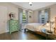 Bright bedroom with a decorative dresser, neutral walls, and chevron curtains for added style at 1600 Dauphin Ln, Orlando, FL 32803