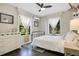 Relaxing bedroom with hardwood floors, light color palette, natural light, and sleek furniture at 1600 Dauphin Ln, Orlando, FL 32803