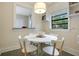 Dining area featuring a round table with seating and a view to the outside at 1600 Dauphin Ln, Orlando, FL 32803