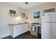 Bright kitchen with white cabinets, subway tile backsplash, and granite countertops at 1600 Dauphin Ln, Orlando, FL 32803