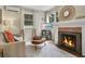Cozy living room with fireplace, modern decor, and hardwood floors at 1600 Dauphin Ln, Orlando, FL 32803