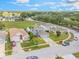 Street view featuring well-kept lawns and houses in a suburban neighborhood at 16243 Wilkinson Dr, Clermont, FL 34714