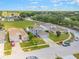 Street view featuring well-kept lawns and houses in a suburban neighborhood at 16243 Wilkinson Dr, Clermont, FL 34714