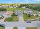 Street view featuring well-kept lawns and houses in a suburban neighborhood at 16243 Wilkinson Dr, Clermont, FL 34714