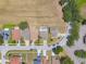 Aerial view of homes with pools and lawns in a suburban community at 16243 Wilkinson Dr, Clermont, FL 34714