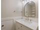 Bathroom featuring a vanity with marble countertop and large mirror at 16243 Wilkinson Dr, Clermont, FL 34714