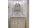 Bathroom featuring a vanity with marble countertop, shelving, and modern lighting at 16243 Wilkinson Dr, Clermont, FL 34714
