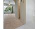 Bright bathroom featuring a large window with a view, tub and floral wallpaper at 16243 Wilkinson Dr, Clermont, FL 34714