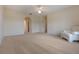 Spacious bedroom with carpet, ceiling fan, and white trim at 16243 Wilkinson Dr, Clermont, FL 34714