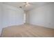 Bedroom with carpet, closet, and ensuite access at 16243 Wilkinson Dr, Clermont, FL 34714
