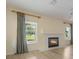 Bright living room with fireplace, new hardwood floors, arches and natural light from the windows at 16243 Wilkinson Dr, Clermont, FL 34714