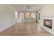 Bright living room with fireplace, new hardwood floors, arches and natural light from the windows at 16243 Wilkinson Dr, Clermont, FL 34714