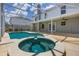 Beautiful pool and hot tub in a screened enclosure, perfect for outdoor relaxation at 16243 Wilkinson Dr, Clermont, FL 34714