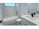 Modern bathroom with quartz counters, new fixtures, and white marble tiling at 16252 Sw 27Th Terrace Rd, Ocala, FL 34473