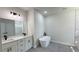 Modern bathroom featuring dual sinks, a standalone tub, and a walk-in shower at 16252 Sw 27Th Terrace Rd, Ocala, FL 34473