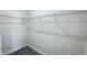 A walk-in closet with wire shelving and neutral walls that is ready for storage and organization at 16252 Sw 27Th Terrace Rd, Ocala, FL 34473