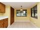 Bright breakfast nook features a window with a pool view and tile flooring at 173 Tollgate Br, Longwood, FL 32750