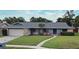Charming single Gathering home with a well maintained lawn, stone accents, and a neutral paint scheme at 173 Tollgate Br, Longwood, FL 32750
