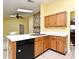 Kitchen with white counters, a breakfast bar, and a view into the living room at 173 Tollgate Br, Longwood, FL 32750