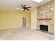 Living room with vaulted ceiling, ceiling fan, and a stone fireplace with a wood mantle at 173 Tollgate Br, Longwood, FL 32750