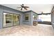 Covered patio featuring brick pavers, ceiling fans, and a convenient pass-through window to the indoor living space at 173 Tollgate Br, Longwood, FL 32750