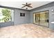 Spacious covered patio with brick pavers and views of the surrounding greenery, ideal for outdoor relaxation and entertaining at 173 Tollgate Br, Longwood, FL 32750