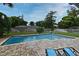 Backyard pool with brick trim, outdoor furniture, and well-maintained lawn at 173 Tollgate Br, Longwood, FL 32750
