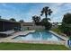 Backyard pool with brick trim, outdoor furniture, and well-maintained lawn at 173 Tollgate Br, Longwood, FL 32750