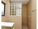 Shower stall with glass block window and neutral tile at 173 Tollgate Br, Longwood, FL 32750