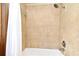 Shower featuring tiled walls, showerhead, and tub with shower curtain at 173 Tollgate Br, Longwood, FL 32750