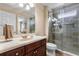 Beautiful bathroom with a glass shower and marble vanity with bronze fixtures at 1813 Glenbay Ct, Windermere, FL 34786