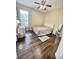 Bedroom with ceiling fan, a window, desk and wood floor at 1813 Glenbay Ct, Windermere, FL 34786