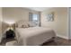Comfortable bedroom featuring a queen-sized bed, a nightstand, and soft, natural light at 1813 Glenbay Ct, Windermere, FL 34786