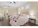 Well-lit bedroom features dark wood floors, white plantation shutters, and a tray ceiling with fan at 1813 Glenbay Ct, Windermere, FL 34786