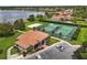 Aerial shot of the community clubhouse, tennis courts, and volleyball court. A beautiful community area at 1813 Glenbay Ct, Windermere, FL 34786