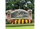 Community sign for The Reserve at Belmere with colorful landscaping at 1813 Glenbay Ct, Windermere, FL 34786