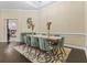 Formal dining room with seating for eight, elegant chandelier, and view into another room at 1813 Glenbay Ct, Windermere, FL 34786