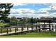 Community dock on the water with gazebo and sitting area at 1813 Glenbay Ct, Windermere, FL 34786